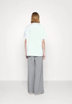 MM6 Maison Margiela Polo - White -Épure Mode Promos Boutique 7d0ff377a46c4a24889bf6501b70154c